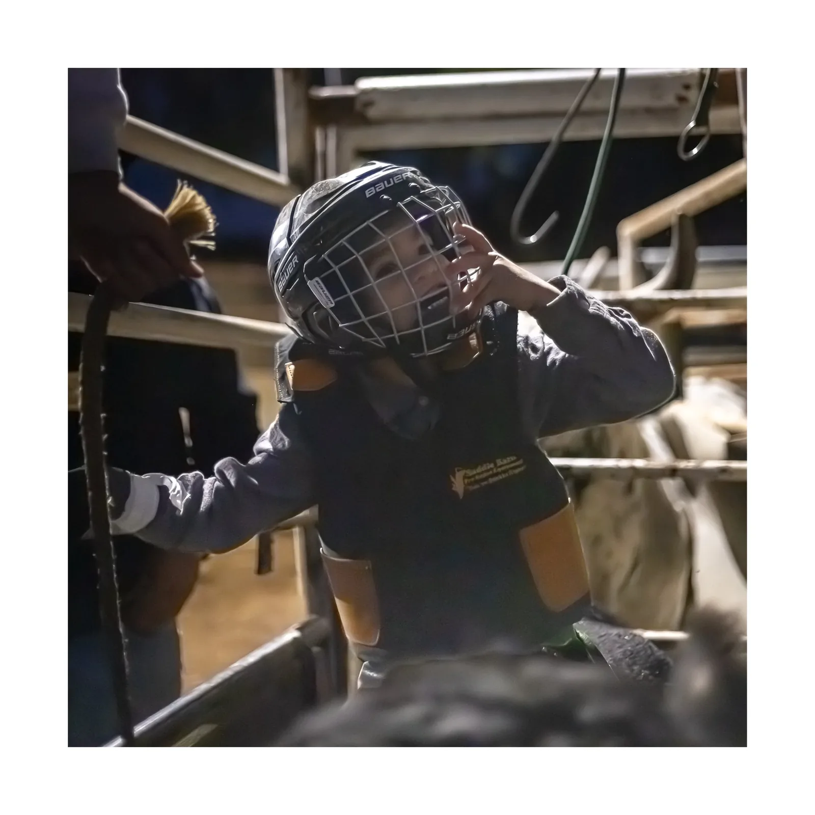 Bull Riding Practice Night — Young rider at the chute